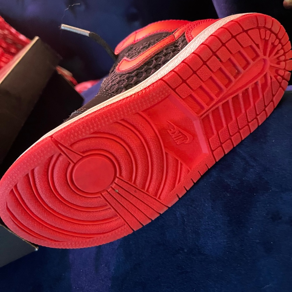 Size 10 in small children. Red and Black Jordan 1 Phat